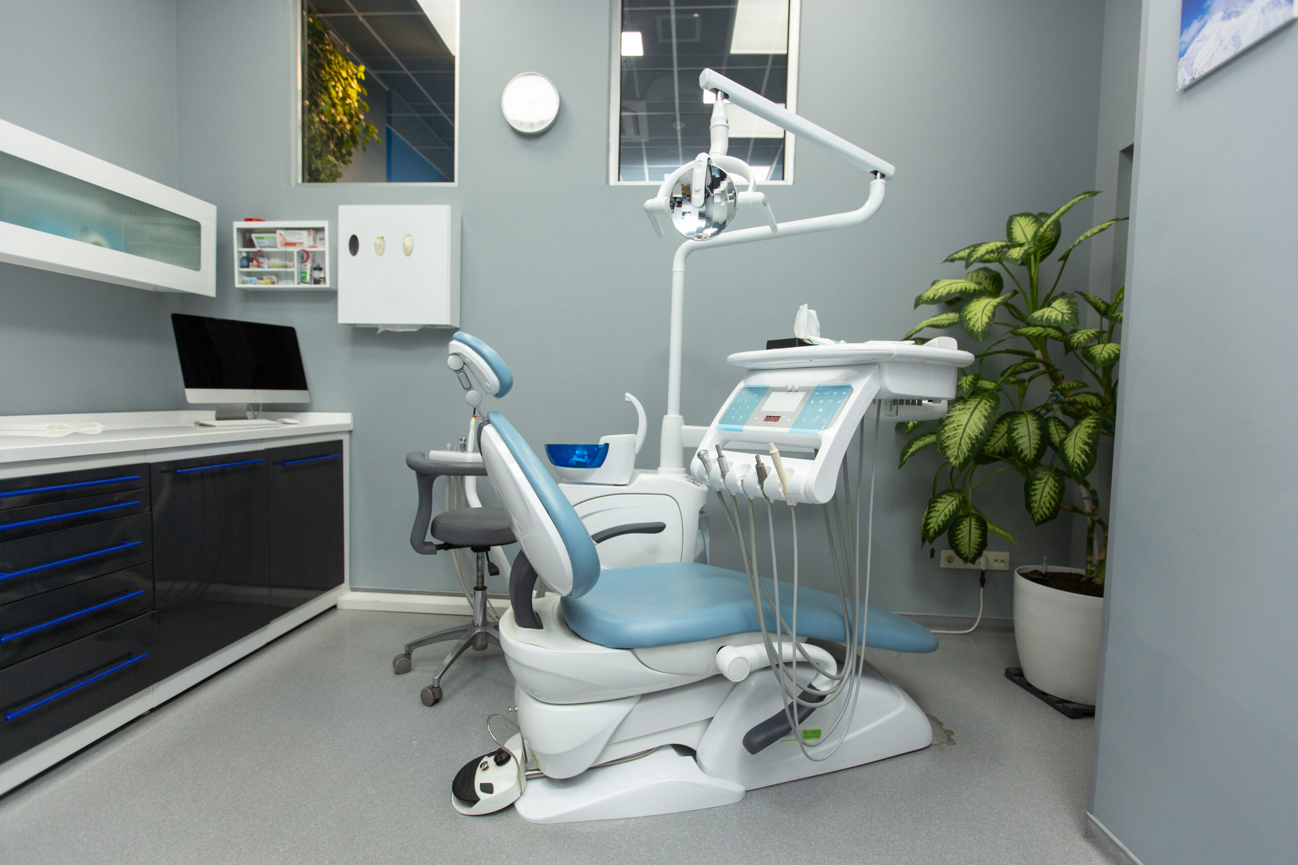 dental cabinet with various medical equipment dental vacuum pump